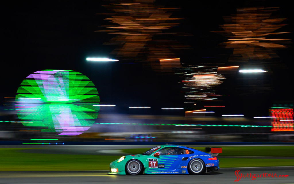 Porsche 2015 Daytona 24 hours: The No. 17 Team Falken Tire's Porsche 911 RSR of Wolf Henzler, Patrick Long and Bryan Sellers, 2015 Daytona, with the blur of the Ferris wheel in b.g. Source: Porsche AG
