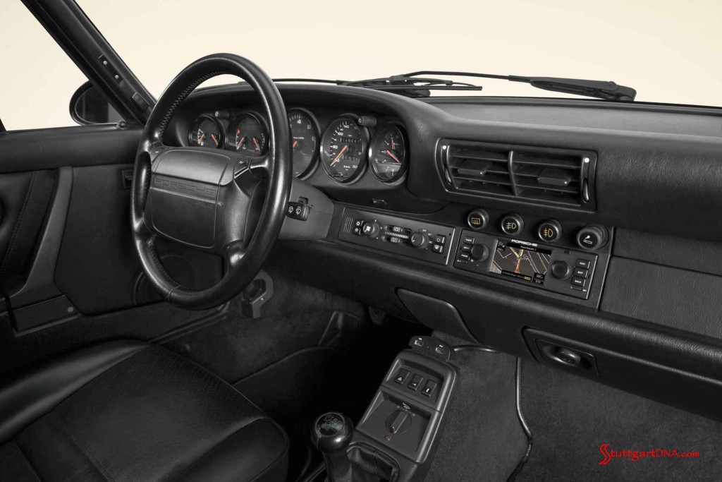 Porsche Classic releases navigation radio: Porsche Classic's new navigation radio is seen here in the dash, from shotgun angle. Credit: Porsche AG