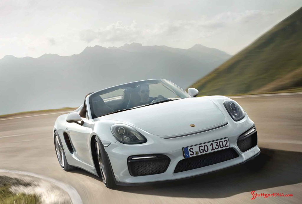 Credit: PCNA Boxster Spyder World Premiere: Seen from its front-right corner, the white Boxster Spyder powers round a turn on a craggy-mountain road. Credit: PCNA