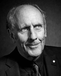 A black & white portrait of past overall Le Mans winner Hans Joachim Stuck; pictured here for Magic Moments in Le Mans. Credit: Porsche AG