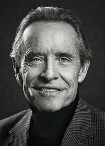 A black & white portrait of past overall Le Mans winner Jacky Ickx; pictured here for Magic Moments in Le Mans. Credit: Porsche AG