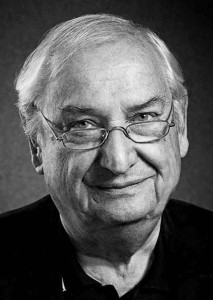 A black & white portrait of Porsche legend Norbert Singer; pictured here for Magic Moments in Le Mans. Credit: Porsche AG