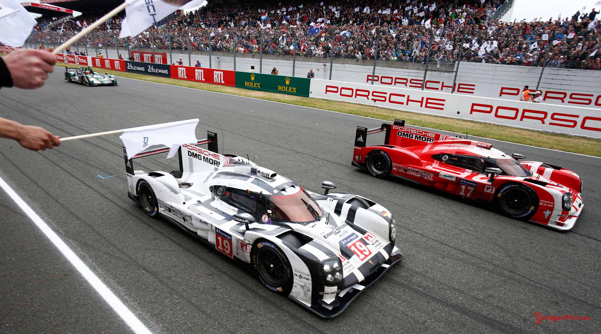Porsche confirms LMP1 program through 2018 Seen here are the Porsche LMP1 919 No. 17 and No. 19 on track between the straightaway grandstands, at Le Mans, 2015. Credit: Porsche AG