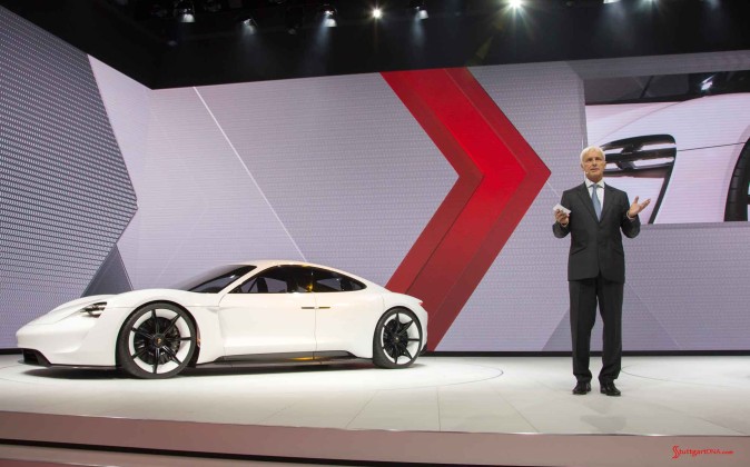 Porsche Mission E Concept Car: Matthias Muller to right side of Mission E at 2015 IAA Show. Credit: Porsche AG