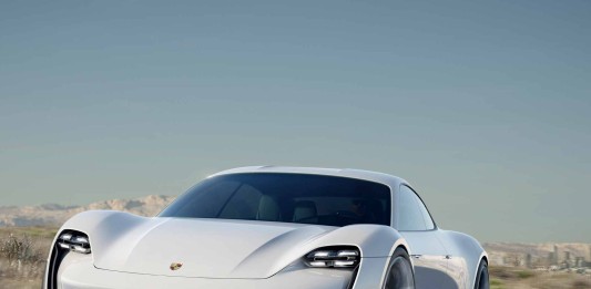 Porsche Mission E Concept Car: Mission E left-front on Mulholland with LA skyline in b.g. Credit: Porsche AG