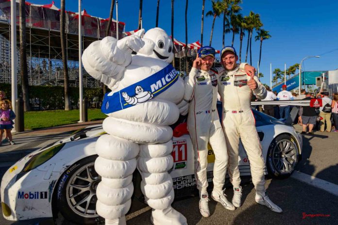 Porsche 911 RSR wins 2016 IMSA Long Beach race: Patrick Pilet and Nick Tandy posing with the Michelin Man in front of their No. 911 Porsche 911 RSR after winning their GTLM class at the 2016 Long Beach IMSA Weathertech SportsCar Championship, round 3. Credit: Porsche AG