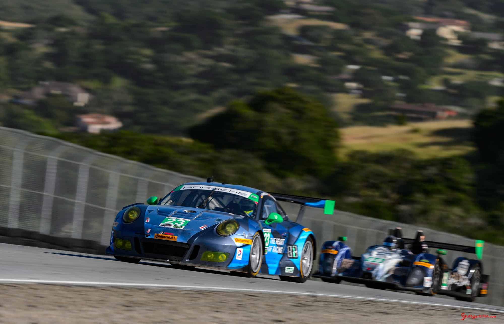 New 2016 Porsche 911 GT3 R wins first race: No. 23 Porsche 911 GT3 R and prototype before Corkscrew at 2016 Laguna Seca. Credit: Porsche AG