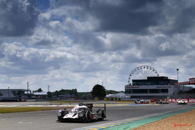 Porsche garners 18th overall win at 84th Le Mans 2016: 919 No. 2 with Porsche Experience Ctr in bg. Credit: Porsche AG