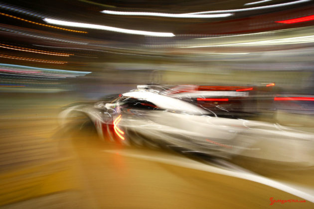 Porsche garners 18th overall win at 84th Le Mans 2016: No. 2 919 in night blur leaving pit. Credit: Porsche AG