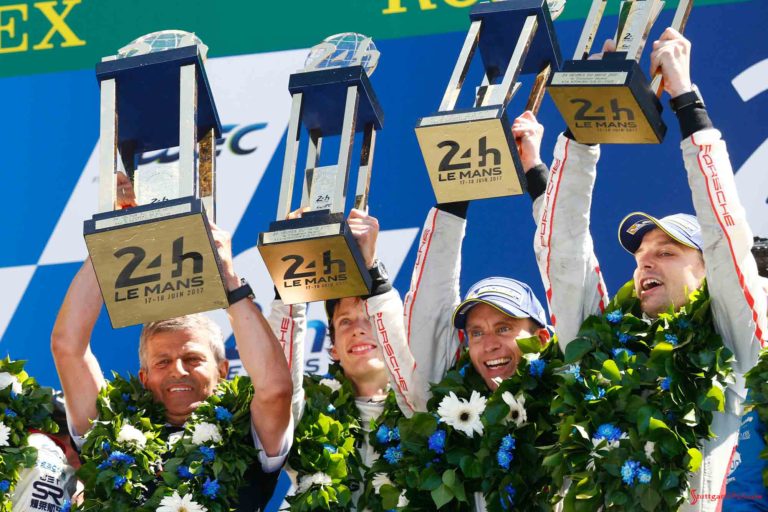 Porsche 2017 Le Mans 24 hat trick – 19th overall win: Enzinger and No-2 winning team of Hartley, Bernhard and Bamber on podium lifting trophies. Credit: Porsche AG