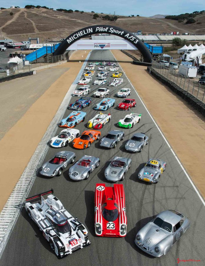 Porsche announces 2018 Rennsport Reunion VI: Shown here on the lower Laguna Seca straightaway between Turns 3 and 4 is the 2015 Porsche Rennsport Reunion V family portrait showing a diverse sampling of Porsche race cars. The grouping spans from the No. 46 356 SL Gmund Coupe to the present-day 919 Hybrid, both Le Mans winners in their respective heydays. Credit: Porsche AG