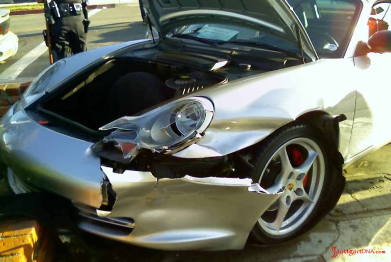 How to choose the best car insurance: Seen here is an Arctic-Silver Porsche, its left-front all smashed up by an oblivious driver making a left turn into the Porsche while texting. Credit: StuttgartDNA