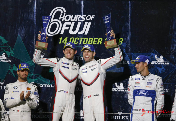 Porsche wins 2018 WEC Fuji 6 Hours: Seen here are the ecstatic, victorious Kevin Estre and Michael Christensen (l-r) at the top of the 2018 WEC Fuji 6 Hrs GTE-Pro podium. Credit: Porsche AG