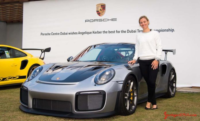 Wimbledon champion Kerber tours Porsche Centre Dubai: Seen here is Kerber posing with a silver 911 GT2 RS in Dubai. Credit: Porsche AG