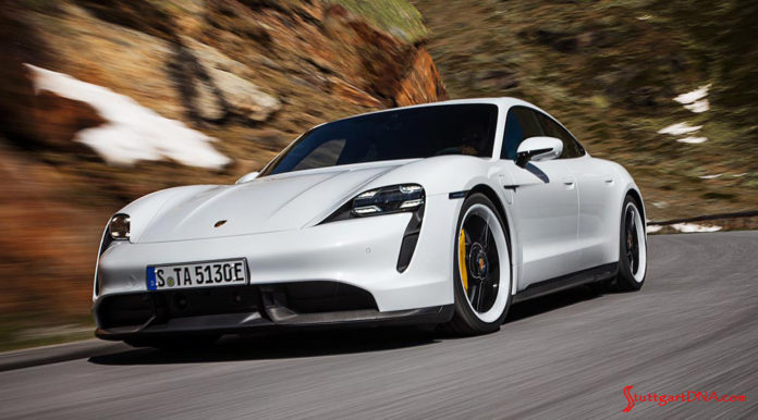 Porsche Taycan first electric sports car world premiere: Depicted here is a gleaming white Taycan Turbo S, left-front, tooling at speed down a windy mountain road. Credit: Porsche AG