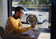 Porsche launches Porsche Finder, its pre-owned vehicle search platform Porsche launches Porsche Finder, its pre-owned vehicle search platform - Pictured here is an African American man operating his smartphone, with his Taycan charging in b.g. Credit: PCNA