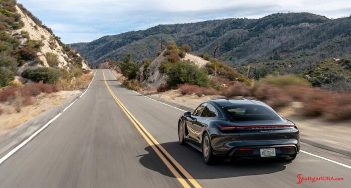 2020 Porsche USA sales: Pictured here is a Taycan 4S, from the left-rear, cruising down a mountain road. Credit: Porsche AG