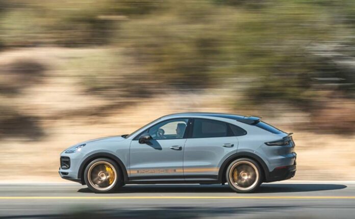 PCNA Q2 sales: Depicted here is a Cayenne, seen from its left, careening down a scenic road. Credit: Porsche AG