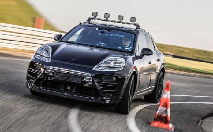 Porsche Macan electric SUV delayed: Depicted here is a camouflaged Macan EV Prototype running on Porsche's Weissach Development Center track. Credit: Porsche AG