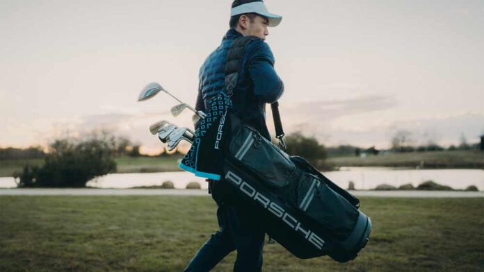 Depicted here is a Golfer carrying Porsche Design golf bag. Credit: Porsche Design