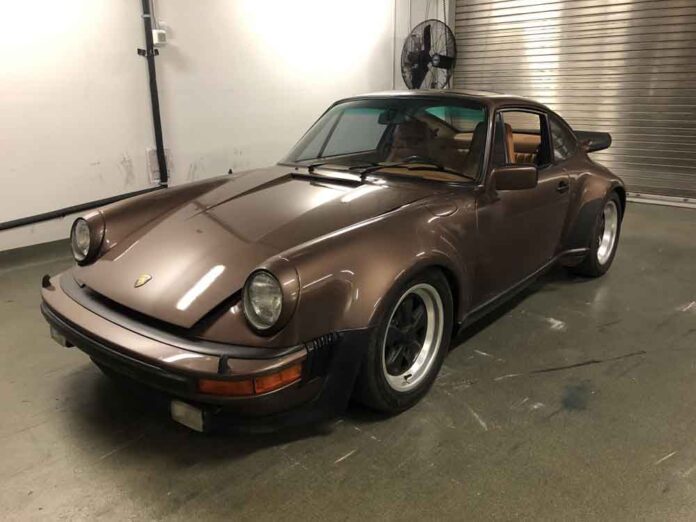 Pictured here is a police photograph of a stolen-and-recovered Copper Brown Metallic Porsche 911 930 Turbo in a garage. Credit: Sarasota Police Department.