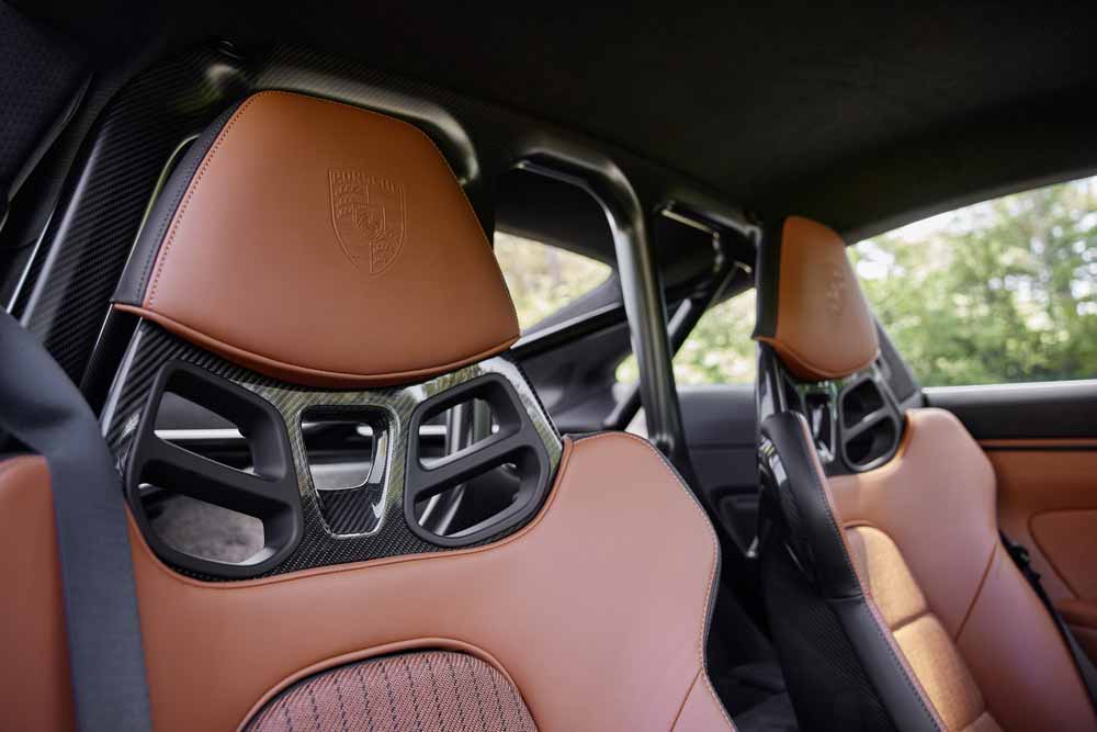 911 S/T - pictured in this shot is a pair of 911 S/T CFRP seats with the Porsche Crest embedded in the headrests. Credit: Porsche AG