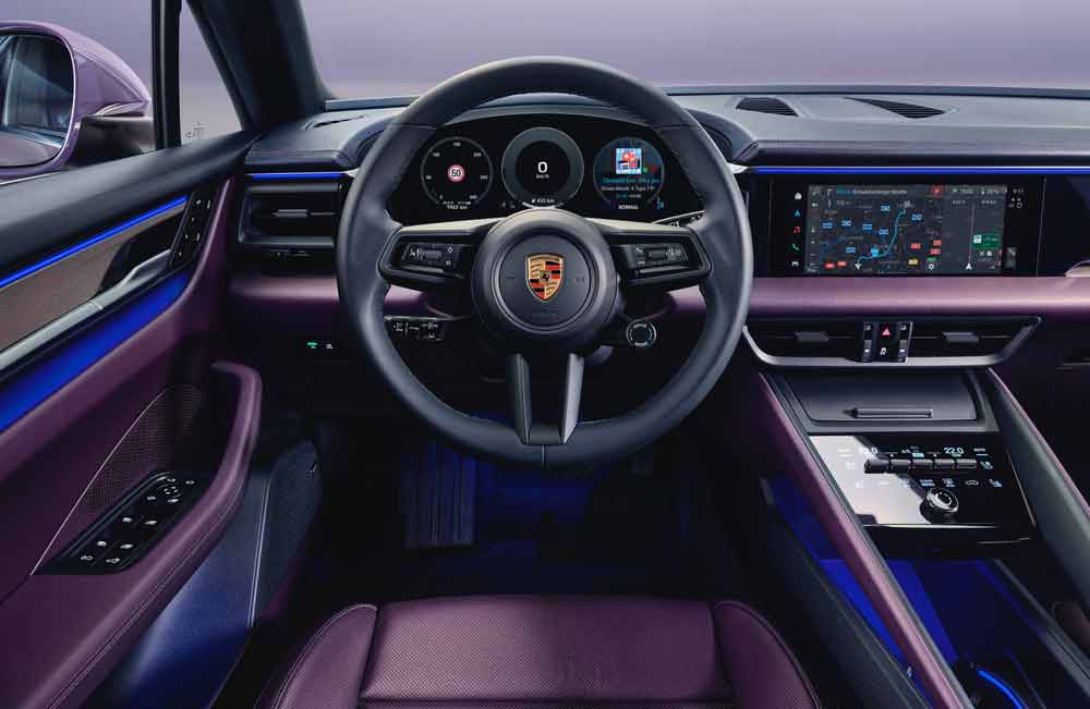 Pictured here is a Porsche Macan EV's steering wheel and PCM. Credit: Porsche AG