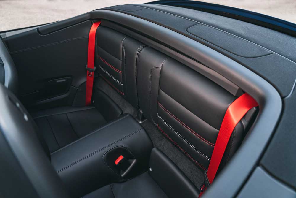 Porsche recalls 911 for seat-belt retractor issues: Pictured here are Porsche 911 red rear seat belts in the back seat. Credit: Porsche AG