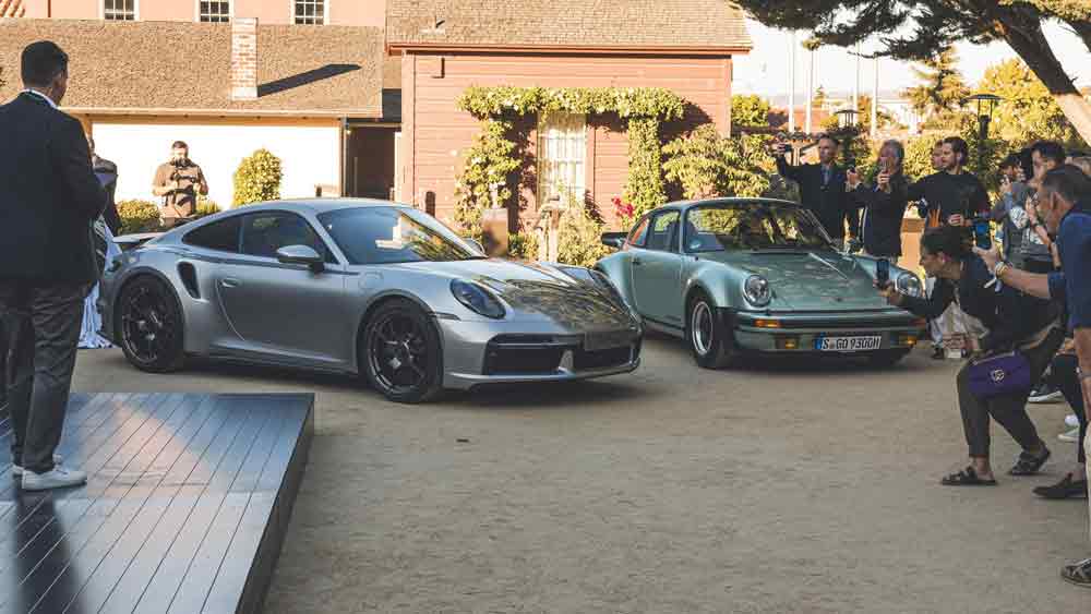 Pictured here is the unveiling of the Porsche 911 50 Years model alongside its predecessor Porsche 911 Type 930 during 2024's Monterey Car Week. Credit: Porsche AG