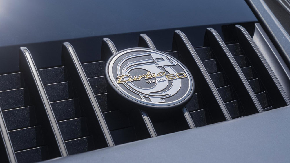 Introducing the Porsche 911 Turbo 50 Years model: Pictured here is a 911 Turbo 50 Years model's rear engine cover badging. Credit: Porsche AG