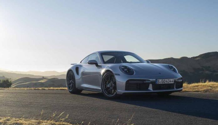 Introducing the Porsche 911 Turbo 50 Years model: Depicted here is a 911 Turbo 50 Years model, right-front, parked on a hilltop. Credit: Porsche AG
