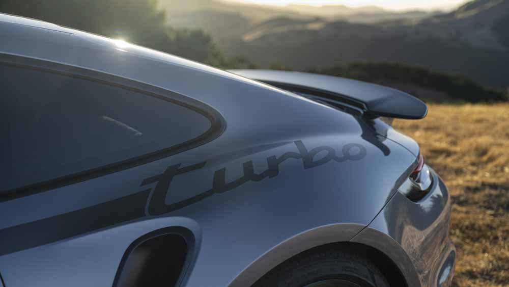 Introducing the Porsche 911 Turbo 50 Years model: Depicted here is a 911 Turbo 50 Years model displaying its vinyl graphic "turbo" script. Credit: Porsche AG