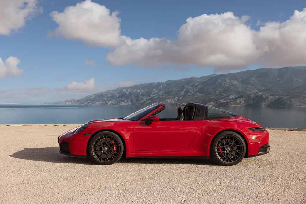 Death of the Porsche 911 Icon - depicted here is a Carmine Red Targa T-Hybrid at shoreside, left side. Credit: Porsche AG