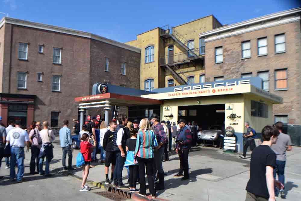 Luftgekühlt 10 returns to the Universal Studios Backlot: Pictured here are show spectators in the foreground of a "Porsche gas station" on the Backlot at Luft 6. Credit: StuttgartDNA