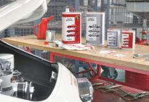 Motor Oil 101 Basics for classic air-cooled Porsche cars Pictured her is a display of Porsche Classic Motoroil in the background of a 356 in garage. Credit: Porsche AG