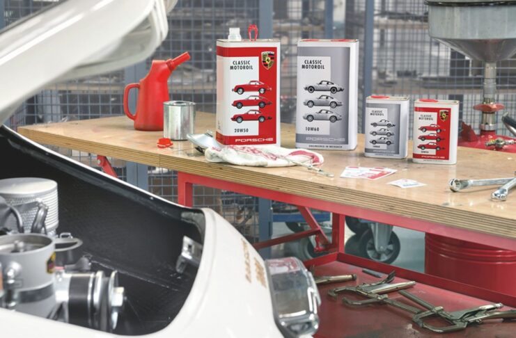 Motor Oil 101 Basics for classic air-cooled Porsche cars Pictured her is a display of Porsche Classic Motoroil in the background of a 356 in garage. Credit: Porsche AG