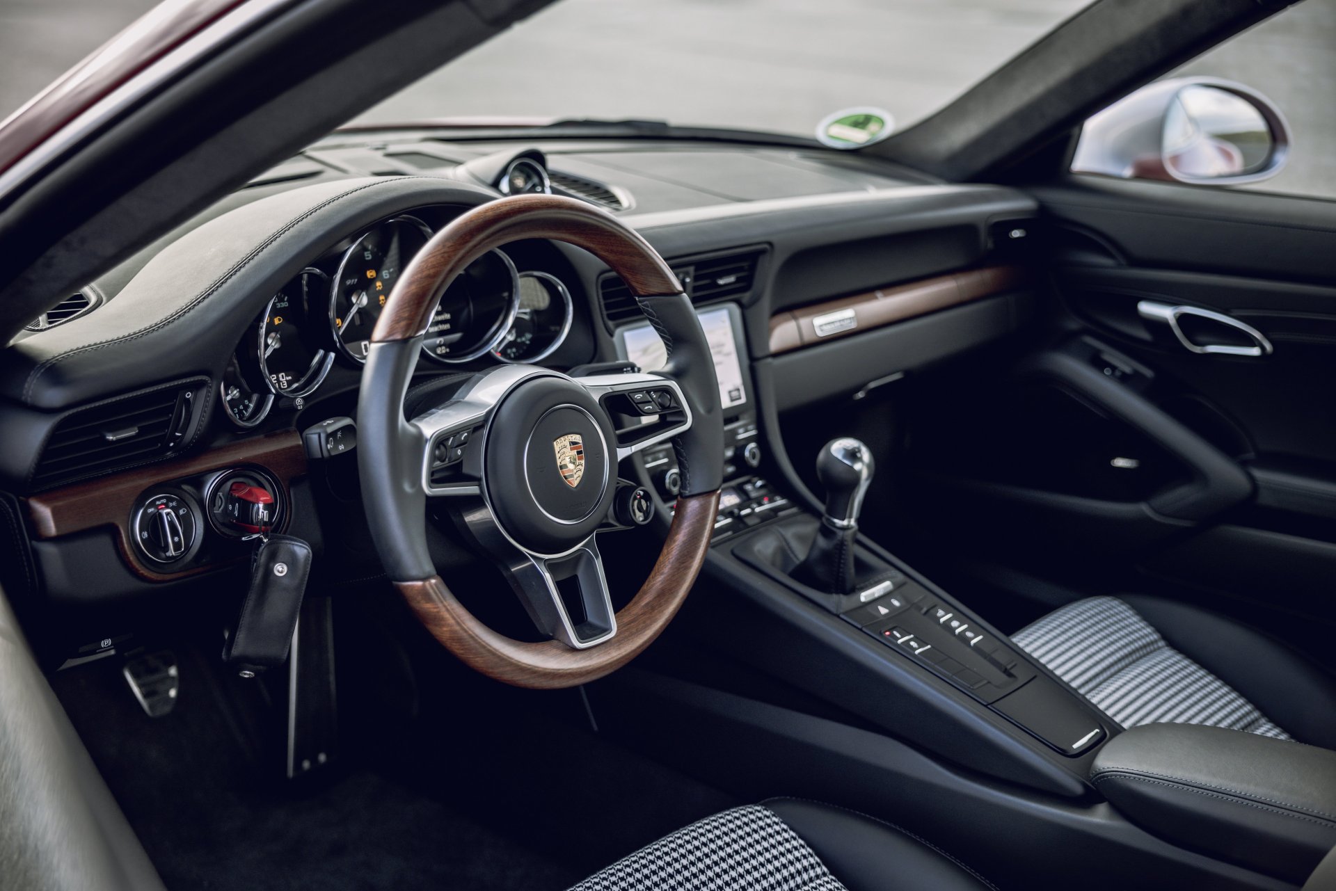 991.1-Gen Porsche 911 Buyer Guide: Pictured here is a Red 991.1's driver-side interior. Credit: Porsche AG